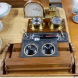 A group of desk items and barometer.