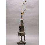 An early 20th century bronze and gilt brass classical oil lamp base converted for electricity,