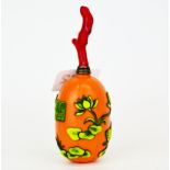 An unusual Chinese three colour carved Peking cameo glass snuff bottle with coral stopper with