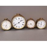 A group of four brass alarm clocks, largest Dia. 14cm.