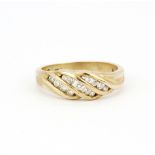 A hallmarked 9ct yellow gold diamond set ring, (S).