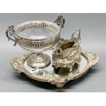 A French silver plated mirrored tray, W. 41cm, together with a silver plated centerpiece and a