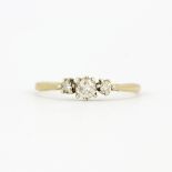 An 18ct yellow gold ring set with brilliant cut diamonds, (R.5).