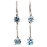 A pair of 925 silver drop earrings set with round cut blue topaz and white stones, L. 5cm.