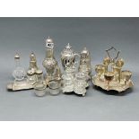 A group of silver plated sugar shakers and other items.