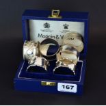 A cased pair of Mappin & Webb hallmarked silver napkin rings with a further hallmarked pair and an