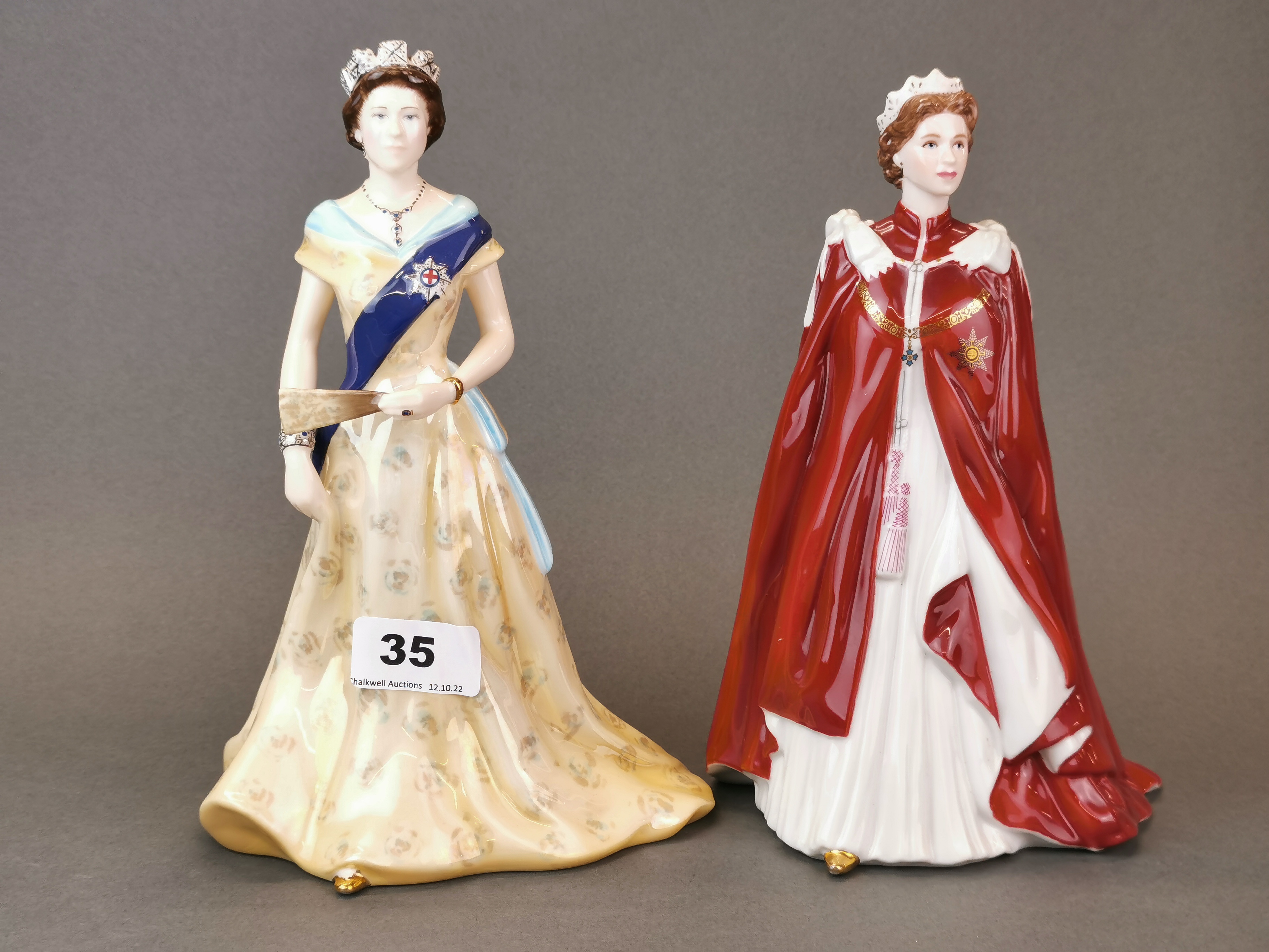 Two Royal Worcester porclain figures of Queen Elizabeth II, H. 23cm.