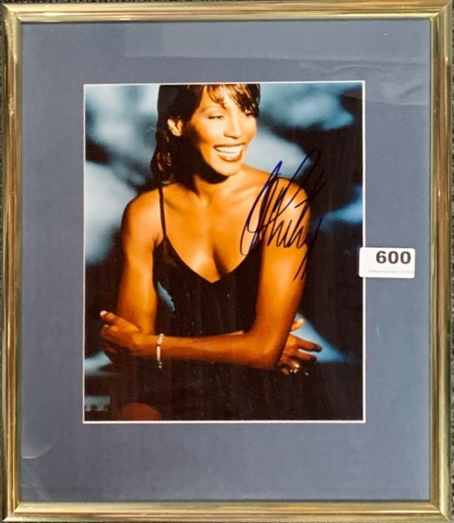 Autograph interest: A framed signed autograph photograph of Whitney Houston.