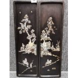 A pair of early 20th century Chinese mother of pearl inlaid black hardwood panels, H. 59 x 16cm.