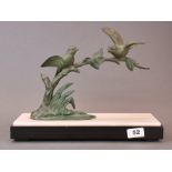 An Art Deco bronze figure of two birds on a marble base, W. 35cm. H. 27cm.