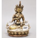 A Tibetan bronze/brass figure of a seated Tara with hammered copper base cover, H. 22cm.