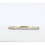 A hallmarked 9ct yellow gold half eternity ring set with brilliant cut diamonds, (Q.5).