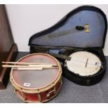 A snare drum and a Melody Major banjo.