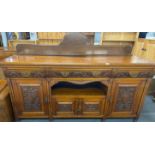 A large oak sideboard c. 1910, W. 183cm, H. 128cm.