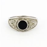 A gent's 925 silver onyx and diamond set signet ring, (Z+4.5).