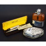 A hallmarked silver topped and cut glass dressing table item together with a silver plated hip flask