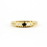 An 18ct yellow gold sapphire and diamond set ring, (M.5).