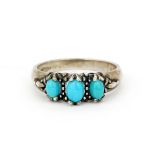 A 925 silver ring set with oval cabochon turquoise, (T.U).