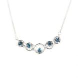 A 925 silver necklace set with round cut London blue topaz.