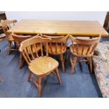 A large pine kitchen table and five chairs, table size 183 x 82cm.