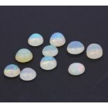 A quantity of unmounted natural oval cabochon opals, approx. 10.25ct total.