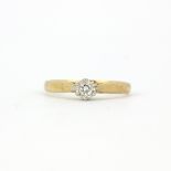 A hallmarked 9ct yellow gold solitaire ring set with a brilliant cut diamond, (J.5).