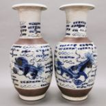 A pair of Chinese hand painted and crackle glazed porcelain vases, H. 45.