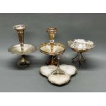 A silver plate and cut glass hors d'oeuvres dish, and three silver plated centerpieces.