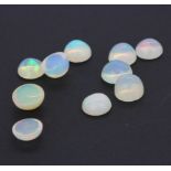 A quantity of unmounted natural oval cabochon opals, approx. 10.47ct total.