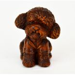 A small carved fruitwood figure of a poodle puppy, H. 5cm.