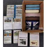 A quantity of mixed albums of postcards.