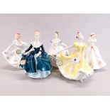 A group of five Royal Doulton porcelain figures with boxes.