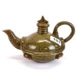 An unusual Chinese olive green glazed and incised pottery tea pot shaped as a mythical tortoise with