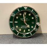 A Rolex design metal battery wall clock.