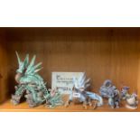 A collection of nine ceramic and other dragon figures, largest H. 28cm.