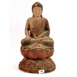 A Chinese carved and painted wooden figure of a seated Buddha, H. 50cm.