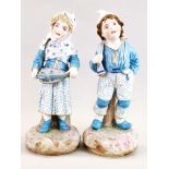 A pair of French hand painted Bisque porcelain figures of a boy and girl.