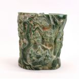 A Chinese carved jade / hardstone brush pot carved with scenes of scholar's among trees, H. 16cm, W.