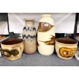 A group of West German pottery vases and plant holders, tallest H. 26cm.