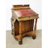A superb 19th century walnut veneered Davenport desk with turned column supports and drawers on both
