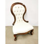 An upholstered Victorian style nursing chair.