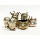 A quantity of hallmarked silver cruet items (one large mustard pot missing liner).