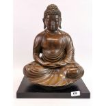 A fine Chinese bronze figure of a seated Buddha on a black composition base, H. 40cm, W. 32cm.