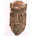 An interesting Oriental carved wooden Garuda mask, H. 37cm.