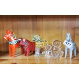 A group of Swedish painted wood and glass animals, tallest H. 12cm.