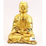 A Tibetan gilt bronze figure of a seated buddha, H. 25cm.