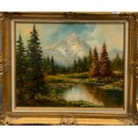 A gilt framed oil on canvas of a mountain landscape, frame size 74 x 66cm.