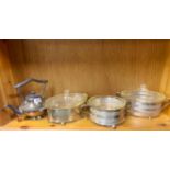 Three vintage silver plate oven proof glass serving dishes and a silver plated kettle.