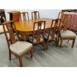 An impressive Chinese design carved teak wood dining suite, comprising of an extending dining