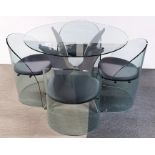 An impressive contemporary plate glass circular table and four chairs with aluminium table